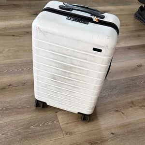 Away White Suitcase with Black Logo needs repair